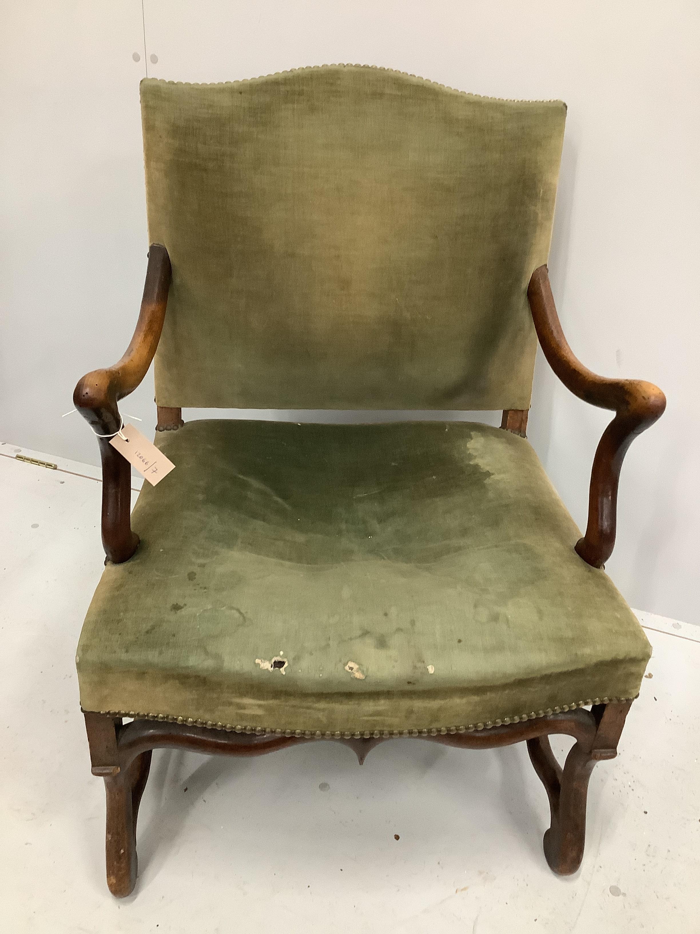 An 18th century French walnut elbow chair, width 63cm, depth 57cm, height 95cm